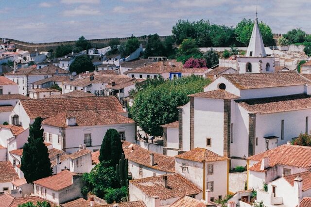 Medieval walls and whitewashed houses in the historic town of Óbidos
