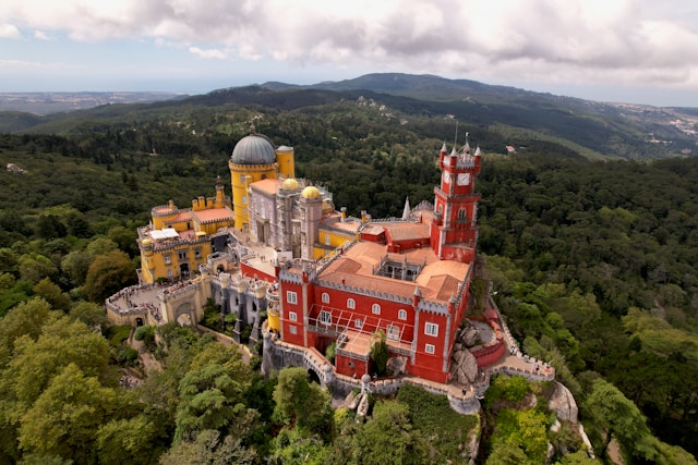 Colourful Pena Palace surrounded by forest in Sintra Portugal