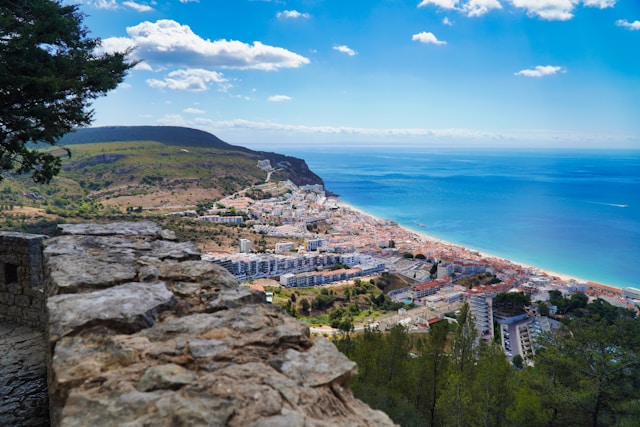 View of the coastal town of Sesimbra in front of the deep blue ocean