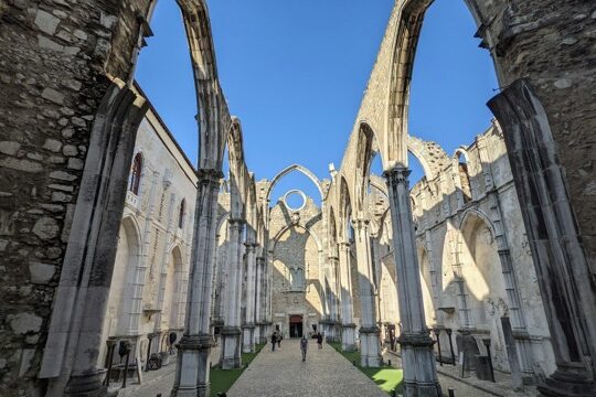 Inside the Carmo Convent in Lisbon, with roofless Gothic arches open to the sky